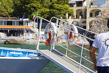 Rear view of a man standing near a boat, Capri, Campania, Italy