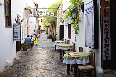 Empty chairs and tables in front of a restaurant in a street, Ephesus, Turkey