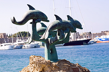 Statues at the seaside, Mandraki Harbor, Rhodes, Dodecanese Islands, Greece