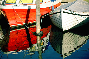 Two boats docked at the harbor, Funen County, Denmark