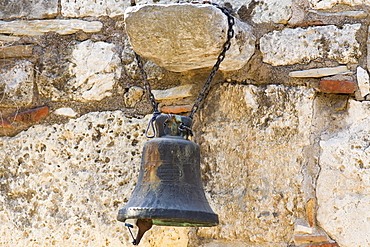 Close-up of a bell hanging on a rock, Athens, Greece