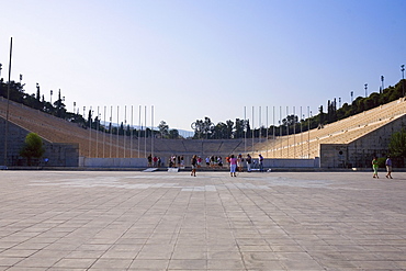 Tourists in an amphitheater, Theater Of Herodes Atticus, Acropolis, Athens, Greece