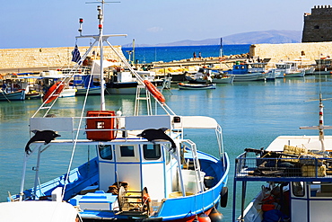 Boat at a harbor with a fortress in the background, Venetian Fortress, Heraklion Harbour, Heraklion, Crete, Greece