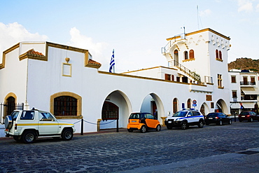 Cars parked in front of a building, Patmos, Dodecanese Islands, Greece
