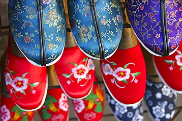 High angle view of embroidery slippers in racks, Beijing, China