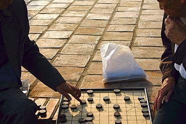 Two men playing a board game, Hanoi, Vietnam