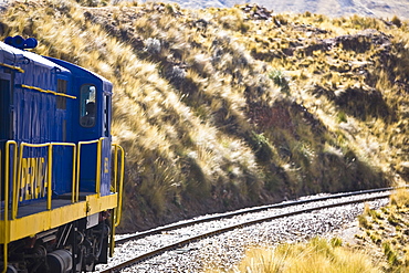 Train passing through a landscape, Puno, Cuzco, Peru