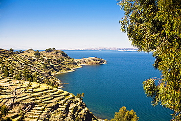 Rock formations along a lake, Taquile Island, Lake Titicaca, Puno, Peru