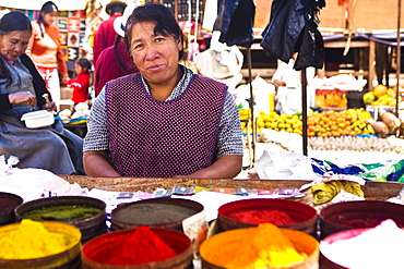 Portrait of a mature woman standing at a market stall, Peru