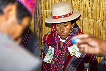 Close-up of a young man sitting at a wedding ceremony, Taquile Island, Lake Titicaca, Puno, Peru