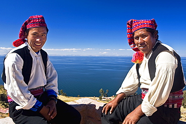 Portrait of two young men sitting, Taquile Island, Lake Titicaca, Puno, Peru