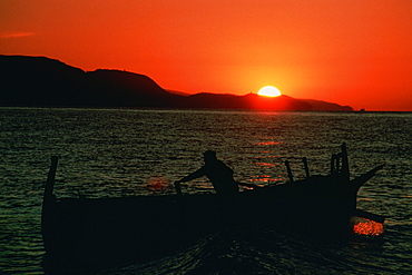 Silhouette of a fisherman on a fishing boat, Malaga, Spain