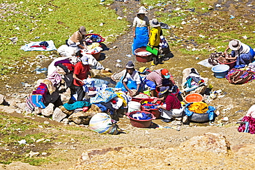 High angle view of a group of women washing clothes, Puno, Cuzco, Peru