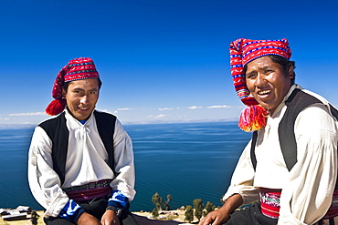 Portrait of two young men sitting, Taquile Island, Lake Titicaca, Puno, Peru