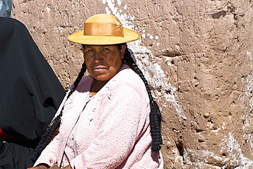 Portrait of a mid adult woman taking part in a wedding ceremony, Taquile Island, Lake Titicaca, Puno, Peru