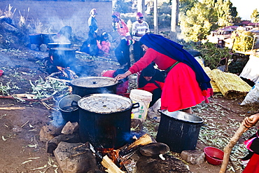 Side profile of a mature woman preparing food, Taquile Island, Puno, Peru