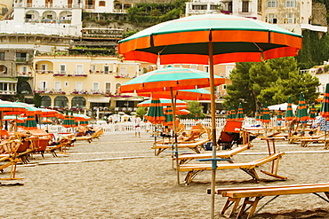 Lounge chairs with beach umbrellas on the beach, Spiaggia Grande, Positano, Amalfi Coast, Salerno, Campania, Italy