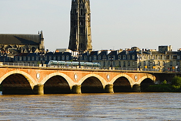 Cable car on a bridge, Pont De Pierre, St. Michel Basilica, Garonne River, Bordeaux, Aquitaine, France