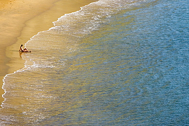 High angle view of a person sitting on the beach, Plage du Miramar, Biarritz, France