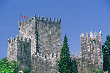 Flag on the top of a castle, Dukes of Braganca Palace, Guimaraes, Minho, Portugal