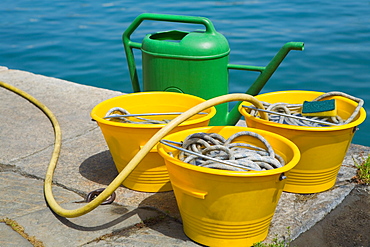 Close-up of buckets with a watering can, Italian Riviera, Santa Margherita Ligure, Genoa, Liguria, Italy