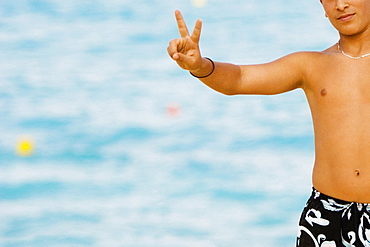 Close-up of a man making a peace sign, Nice, Provence-Alpes-Cote D'Azur, France