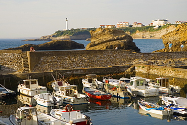 Boats moored at a port, Port Des Pecheurs, Baie De Biarritz, Phare De Biarritz, Biarritz, France