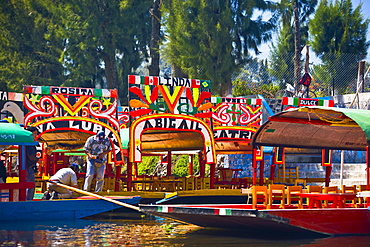 Two men on a trajineras boat, Xochimilco Gardens, Mexico City, Mexico