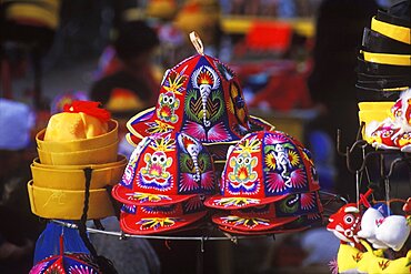 Close-up of caps and toys in a market