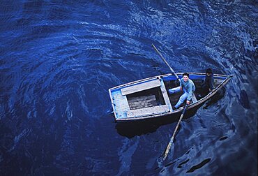 High angle view of a man and a woman in a rowboat