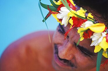 High angle view of a young man wearing a laurel wreath, Hawaii, USA