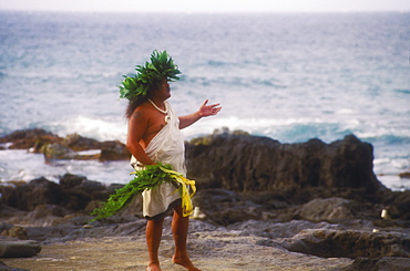 Side profile of a mid adult man standing on the beach