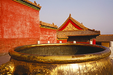 Golden decorative urn in a courtyard, China