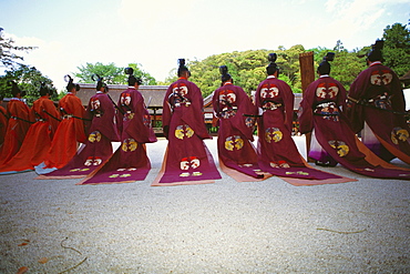 Rear view of a group of people in a traditional festival, Hollyhock Festival, Kamigamo Shrine, Kyoto Prefecture, Japan