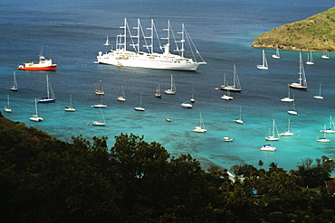 Scenic view of a large group of sailboats in the sea, The Grenadines