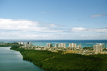 High angle view of a coastal city with lush vegetation, San Juan, Puerto Rico