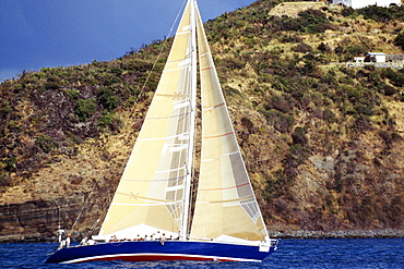 A sailboat is seen participating in the Heiniken Regatta on St. Maarten.