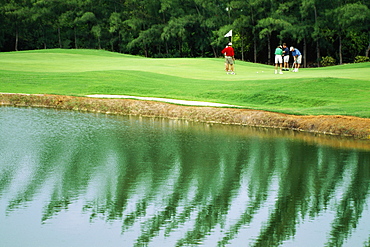 Golfers are seen on a golf course at Wyndham Resort, Jamaica