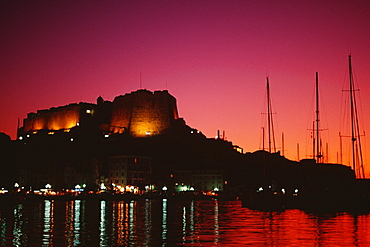 Scenic view of a fortress and a harbor at night, Bonifacio, Corsica, France