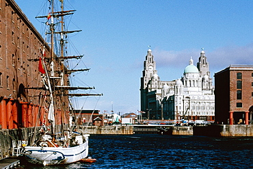 Front view of a clock tower and a boat, Liverpool, England