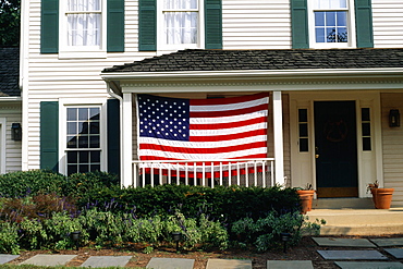 An American flag is displayed on a porch, Bermuda