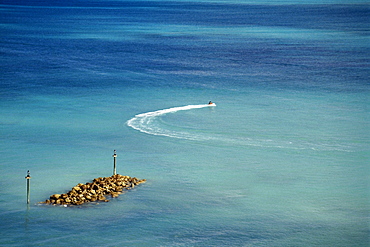 High angle view of two people riding a sea scooter, Nassau, Bahamas