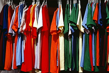 Side view of a row of colorful shirts displayed at a shop, Grand Bahamas, Bahamas