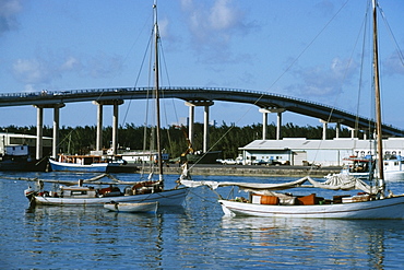 Side view of boats at a harbor on a sunny day, Bahamas