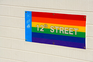 Close-up of a street name sign on the wall