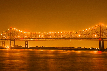 Bridge lit up at night, Mississippi River, New Orleans, Louisiana, USA