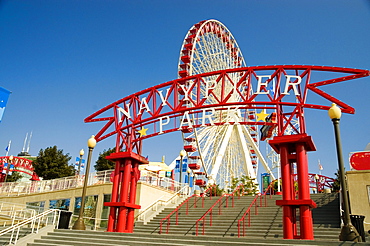 Low angle view of a ferris wheel in an amusement park, Navy Pier Park, Chicago, Illinois, USA