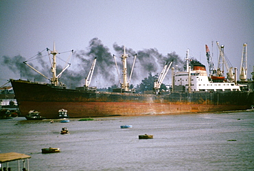 Smoking freighter, Saigon river, Vietnam