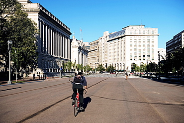 Person cycling on the street, Washington DC, USA