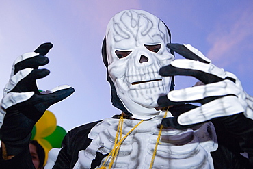 Low angle view of a man wearing a costume and a mask